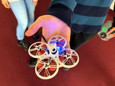  Preston Ficeti, a sophomore at McDonald High School in Trumbull County, holds a drone in the palm of his hand. He learned how to fly it last year by participating in a drone racing league.