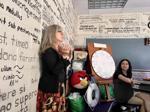 Columbus Academy Latin teacher Christy Bening teaches a high school junior class. Her classroom is covered in Latin graffiti, a way for students to leave their mark.
